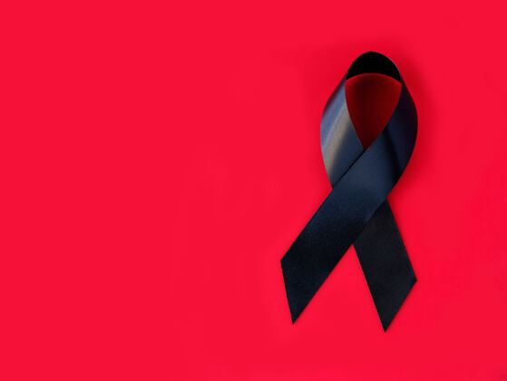 协会红色表面上的黑色符号丝带单身受害者丝带