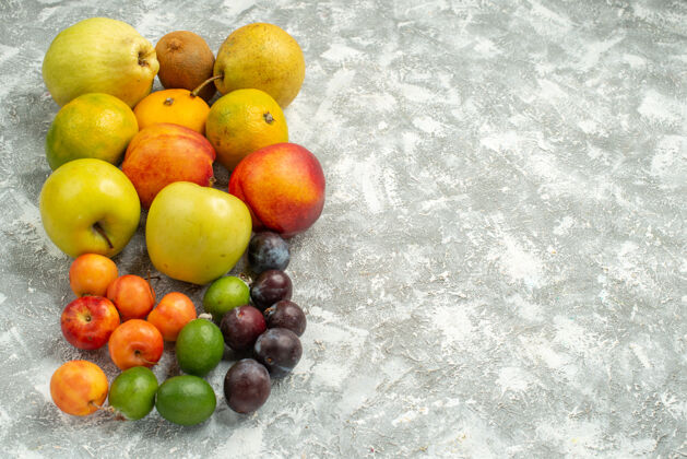 饮食正面视图不同的水果组成新鲜水果的白色空间多汁可食用水果水果