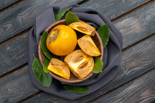 柑橘木桌上观新鲜甜甜的柿子 果香醇厚健康食物水果顶部