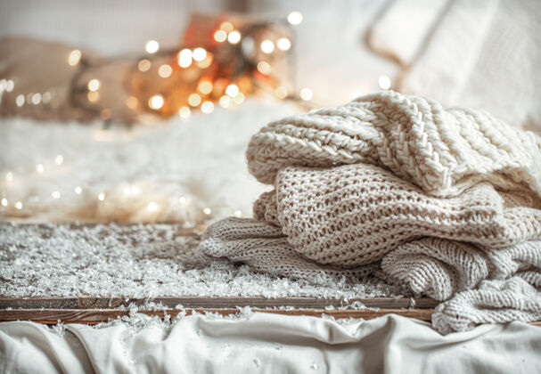 针织舒适的冬季合成与针织物与波基温暖Bokeh毛衣