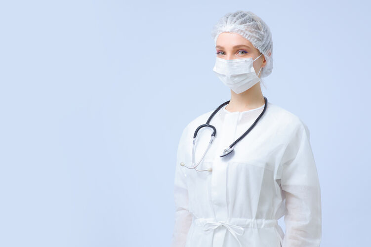 制服戴着医疗帽和面罩的女医生或护士的肖像手套卫生护理