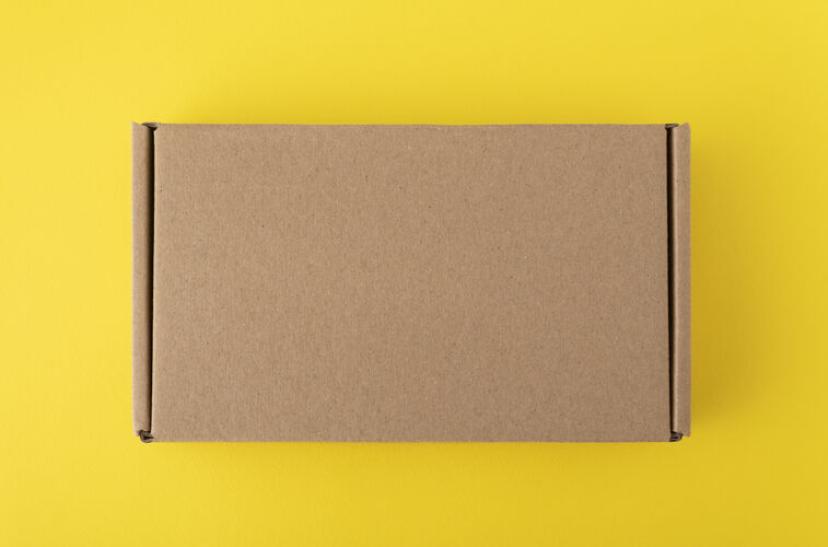 包装黄色纸板箱上没有铭文或图画背景.craft箱形上衣查看.复制空格.mock起来复印空间集装箱纸箱