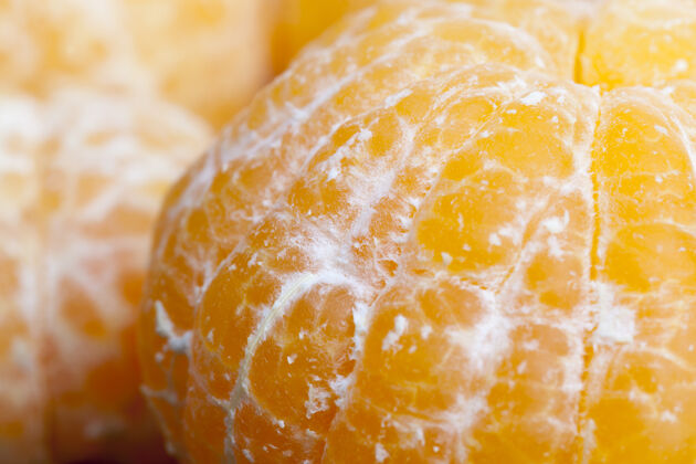 切割甜甜熟透的橙子肉特写交叉季节健康