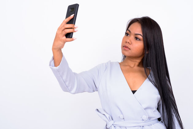 电话年轻的亚洲女人反对空白通信头发女性