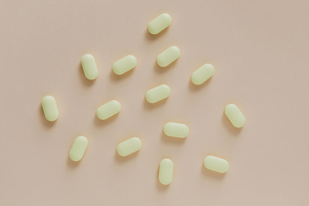 成瘾米色背景上的黄色抗生素麻醉品抗氧化剂医疗保健