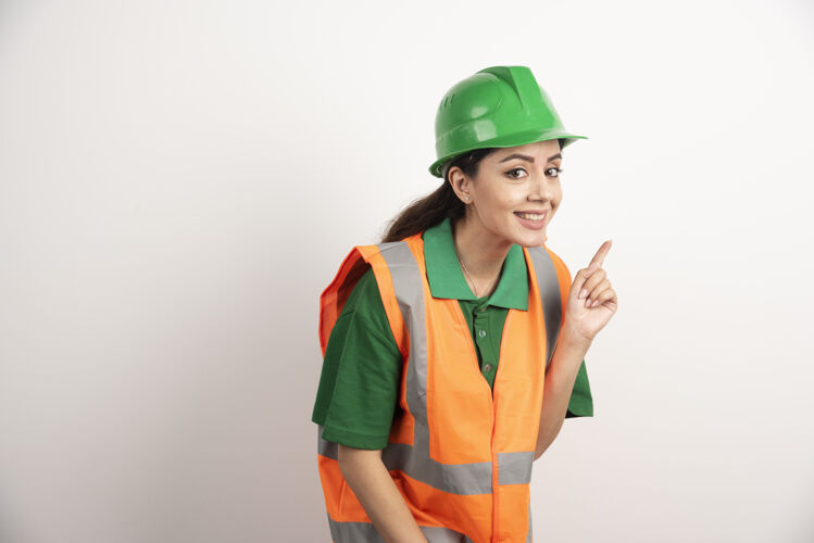 商业成功的女人戴着安全帽穿着制服高质量的照片承包商建筑商建筑师