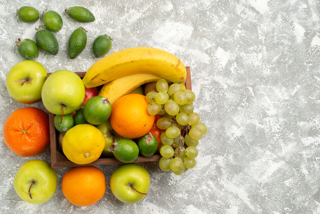 农产品顶视图新鲜水果组成香蕉葡萄和白桌子上的飞珠水果醇厚维生素健康新鲜水果饮食办公桌