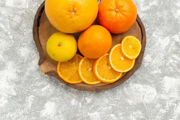 生的顶视新鲜的橘子与橘子在白色的办公桌柑橘异国情调的热带新鲜水果柑橘柑橘热带