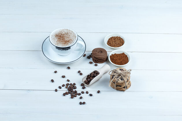 咖啡特写饼干 一杯咖啡与一碗速溶咖啡 咖啡豆 肉桂白色木板背景水平泡沫早餐卡布奇诺