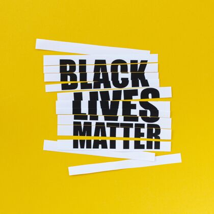 俯视图黄色背景的黑色生命物质信息运动停止种族主义平面图