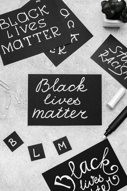 压迫顶视图用黑色生命物质和钢笔选择卡片顶部黑人种族主义
