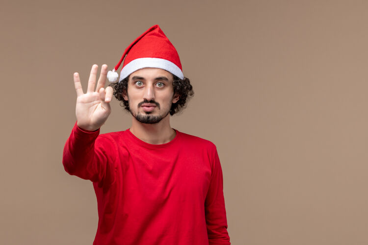 圣诞节正面图红色的男性在棕色背景上显示数字圣诞节男性视图数字