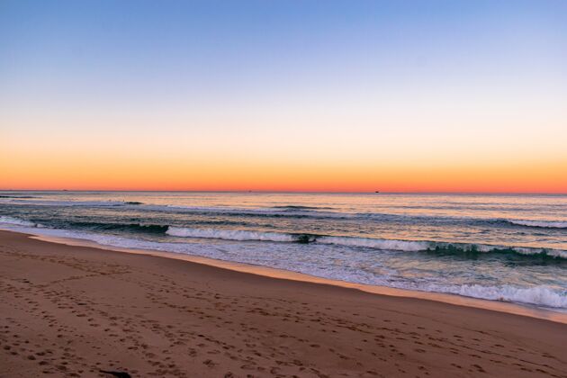海洋海滩上的日落美景阳光天空地平线